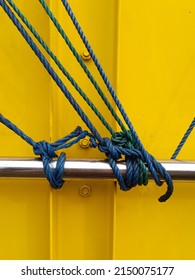 Ratchet Strap For HGV Goods Vehicle Securing A Load With The Strap On A Side Of A Semi Truck Trailer And Rolled Up Securley.