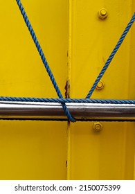 Ratchet Strap For HGV Goods Vehicle Securing A Load With The Strap On A Side Of A Semi Truck Trailer And Rolled Up Securley.