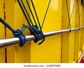 Ratchet Strap For HGV Goods Vehicle Securing A Load With The Strap On A Side Of A Semi Truck Trailer And Rolled Up Securley.