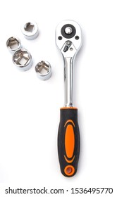 Ratchet wrench with black and orange handles with set of heads for it, isolated over a white background. Tools and hardware for everyday. Construction and repair. Overhead view. Illustration