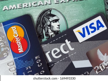 Ratingen, Germany - June 21, 2011: Closeup studio shot of  credit cards issued by the three major brands American Express, VISA and MasterCard.