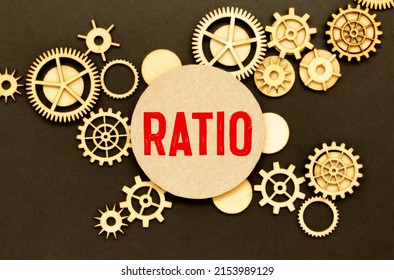 RATIO text on white paper on light background with charts paper.