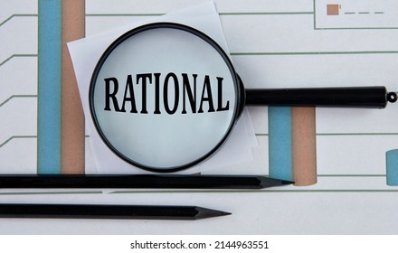 RATIONAL - Word On A Graph With Pencils And A Magnifying Glass. Business Concept