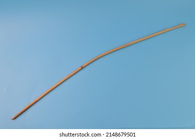 Rattan Cane Sticks Isolated On A Blue Background