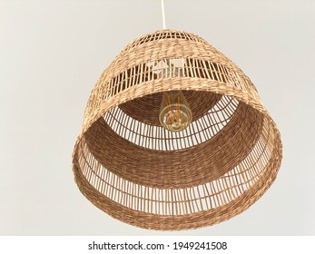 Rattan Ceiling Lamp With Vintage Electric Light Bulb Background.