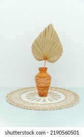 Rattan Pot With Dry Palm Leaves Placed On A Rug Seagrass Isolated On White Background. Photo Studio Property Decoration.