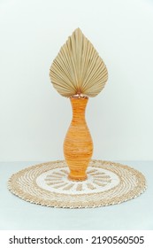 Rattan Pot With Dry Palm Leaves Placed On A Rug Seagrass Isolated On White Background. Photo Studio Property Decoration.