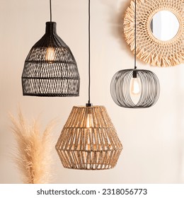 rattan style lighting fixtures hang on wall near decorative pieces