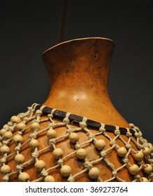 A Rattle Or Shekere, An African Rhythm Instrument Made From Beads Strung Around A Gourd Which Produces A Rattling Sound