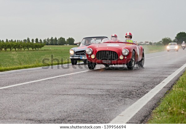 RAVENNA, ITALY - MAY 17: unidentified drivers on\
the old racing car Ferrari 212 export (1951) in rally Mille Miglia,\
the famous italian historical race (1927-1957) on May 17, 2013 in\
Ravenna, Italy