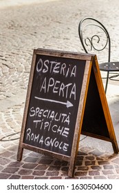 RAVENNA, ITALY - MAY 2, 2019: Light Is Enlightening Signboard Of Italian Tavern