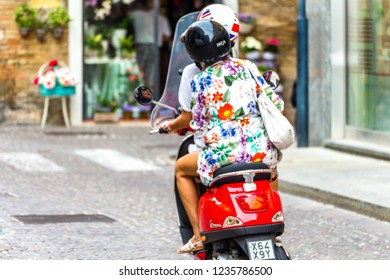 girl riding vespa