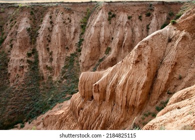 Ravine Formed By Soil Erosion By Wind And Water. High Quality Photo