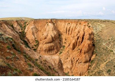 Ravine Formed By Soil Erosion By Wind And Water. High Quality Photo