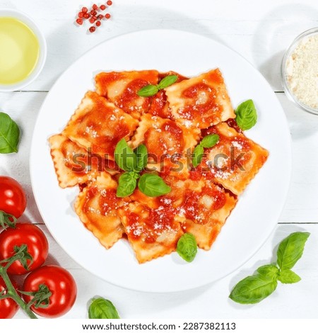 Ravioli pasta meal from Italy for lunch eat dish with tomato sauce top view on a plate and wooden board square