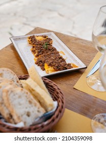 Ravioli With Ragu And Rosemary In Restaurant In Florence With Bread And Wine