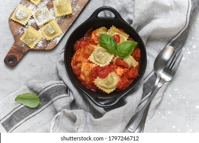 Ravioli Tomato Sauce With Basil On Black Pan. Top View, Recipe  Italian Cuisine.