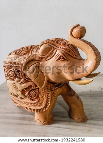 A ravishing traditional elephant statue with amazing carvings and detailing. The elephant has been carved from pure sandalwood which gives out an alluring smell!