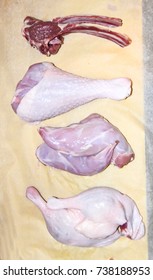 a lot of raw assorted meat rabbit mutton turkey duck pork cooked on a paper background