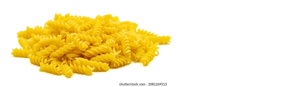 Raw auger pasta isolated on white background. Close-up. Empty space for text. Copy space