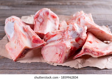 Raw Beef Bone For Making Broth On Wooden Table