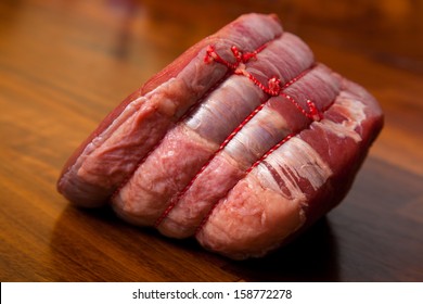 Raw Beef Joint On Walnut Wood Worktop - Ready For Roasting