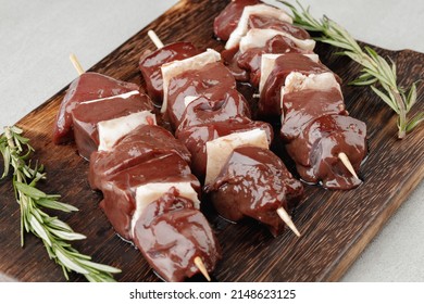 Raw Beef Liver On Skewers On Board