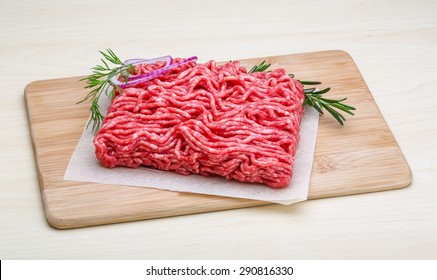 Raw beef minced meat with rosemary and onion