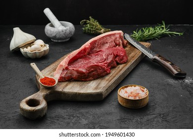 Raw Beef Ribeye Lip On With Skin On Wooden Cutting Board