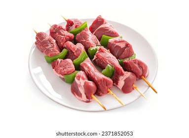 Raw beef shish kebab. BBQ meat with vegetables and spices, white plate  Rustic style, white background  - Powered by Shutterstock