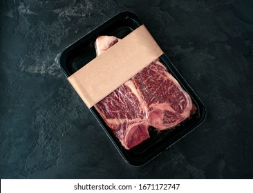 Raw beef steak t-bone in vacuum Packed, mockup for design idea