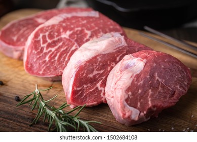 Raw Beef Tenderloin On Wooden Cutting Board