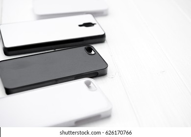 Raw of black and white cases for printing made of nice material, lying on the table