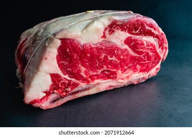 Raw Bone-in Standing Prime Rib Roast: Uncooked Rib Roast Tied With Kitchen Twine