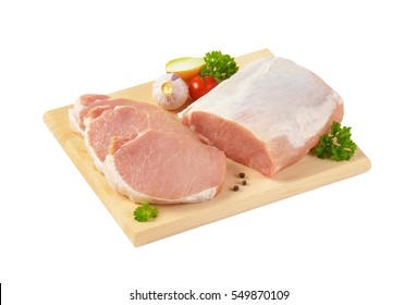 Raw Boneless Pork Loin Chops On Cutting Board