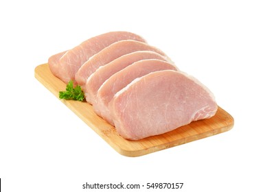 Raw Boneless Pork Loin Chops On Cutting Board