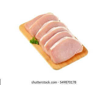 Raw Boneless Pork Loin Chops On Cutting Board