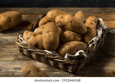 Raw Borwn Organic Russet Potatoes Ready to Cook - Shutterstock ID 1912444168