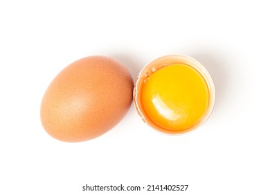 Raw broken egg on a white background. Chicken egg yolk. Healthy diet
