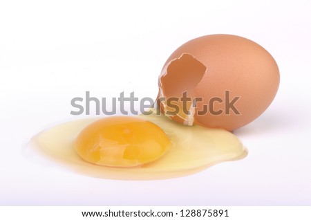Raw broken egg on white background, studio shot