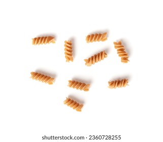 Raw Brown Pasta Isolated, Scattered Wholegrain Fusilli, Dry Whole Grain Noodle, Raw Spelt Macaroni, Healthy Italy Food, Organic Meal, Wholewheat Spiral Pasta on White Background Top View - Powered by Shutterstock