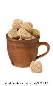 Raw Cane Brown Sugar Cubes In A Ceramic Cup.