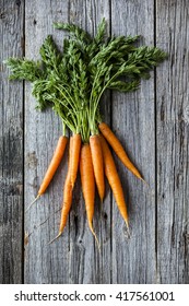 Raw carrots with green tops