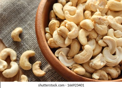 Raw Cashews Close-up In Wooden Bowl On Sackcloth