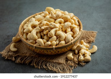 Raw Cashews Nuts In Bowl On Dark Background