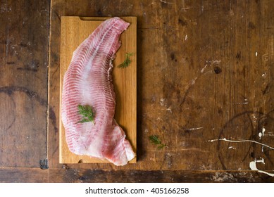 Raw Catfish Fillet On A Wooden Board On A Wooden, Vintage Table