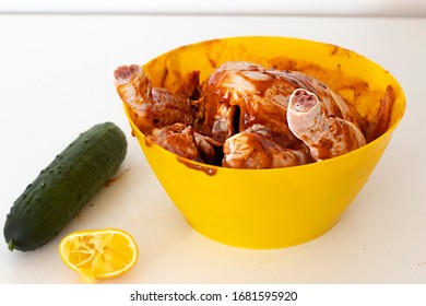 
Raw Chicken Coated In Marinade And Poured With Lemon Juice Ready For Baking.