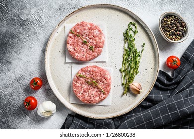 Raw chicken cutlets, ground meat patty. Organic mince. White background. Top view - Powered by Shutterstock