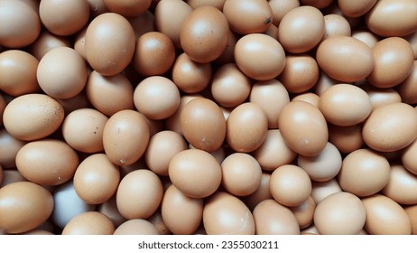 
Raw chicken eggs piled up in wooden boxes at traditional markets, in a state that has not been cleaned. - Shutterstock ID 2355030211
