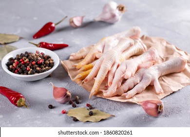 Raw Chicken Feet With Herbs For Making Bone Broth. Natural Collagen Of Animal Origin